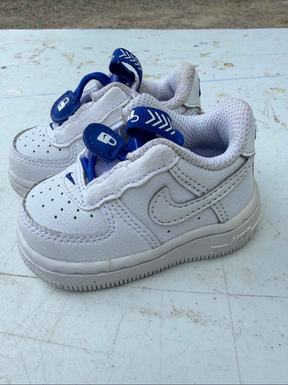 Nike Kids White Sneakers with Blue Accents